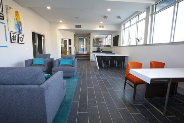 Clubhouse featuring modern design and cozy seating at Vaya Apartments in Greystar luxury community