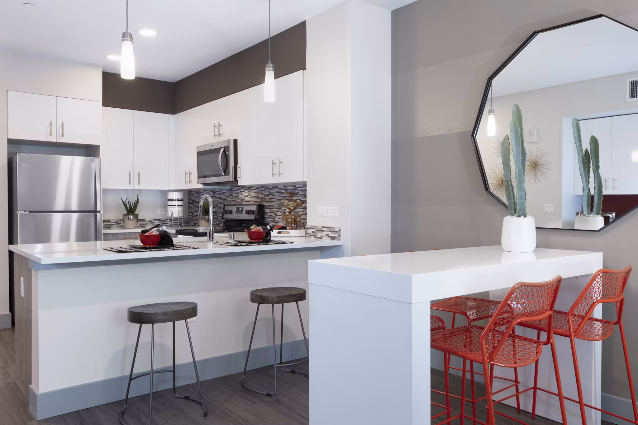 Vaya Apartments: Modern kitchen with sleek countertops and stainless steel appliances in luxury community