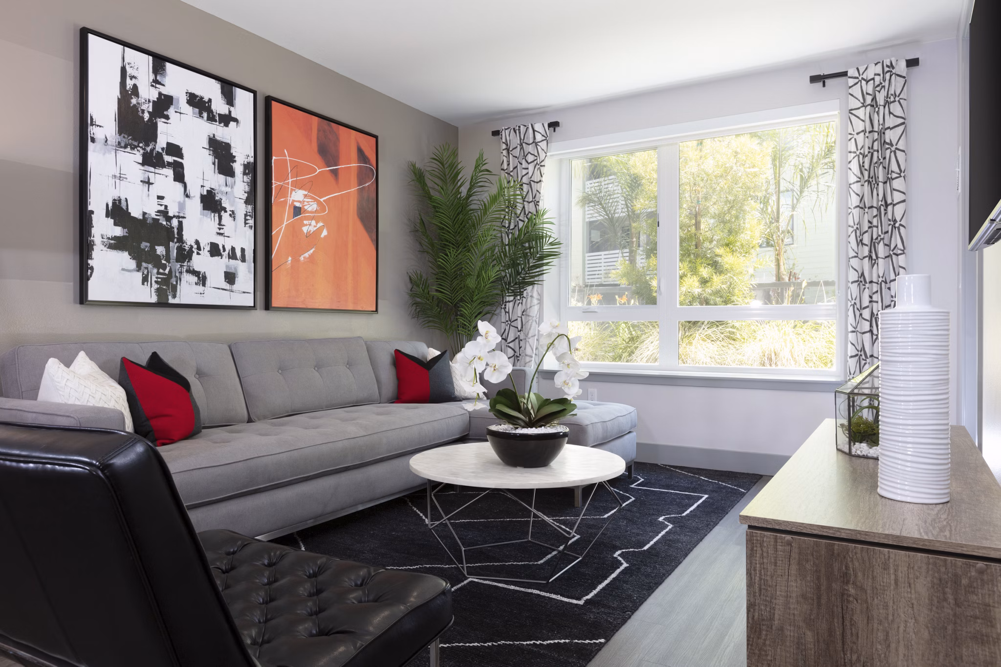 Spacious living room with modern decor and large windows at Vaya Apartments offering luxury living