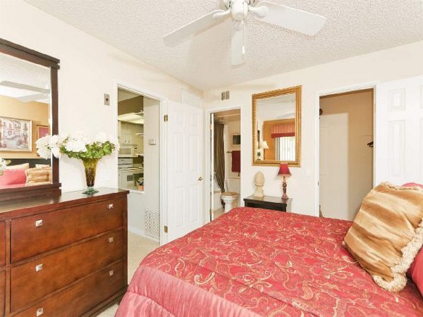 Bedroom featuring elegant hardwood floors at Overlook at Bernardo Heights Apartments