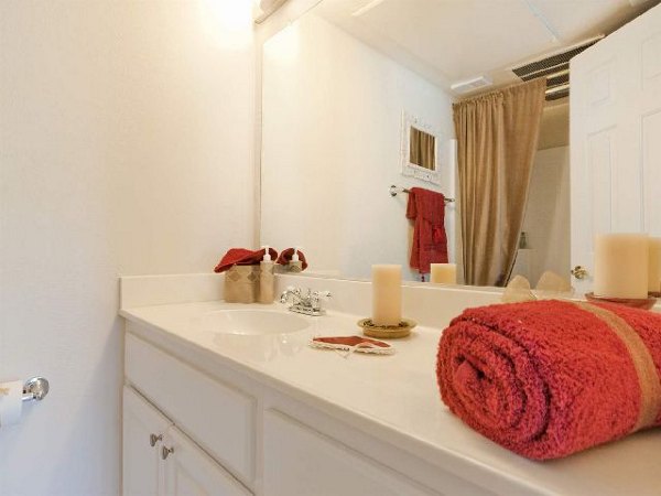 Bathroom featuring modern fixtures and marble countertops in Overlook at Bernardo Heights Apartments