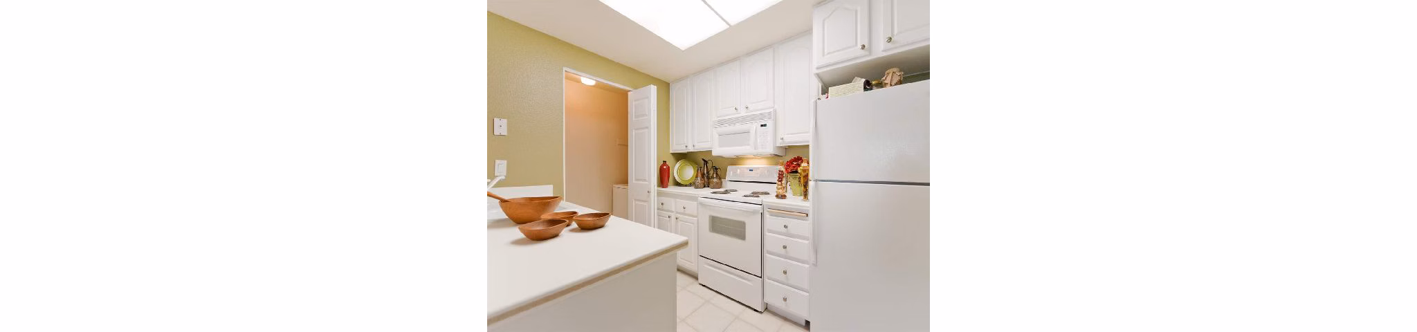 Modern kitchen with stainless steel appliances at Overlook at Bernardo Heights Apartments