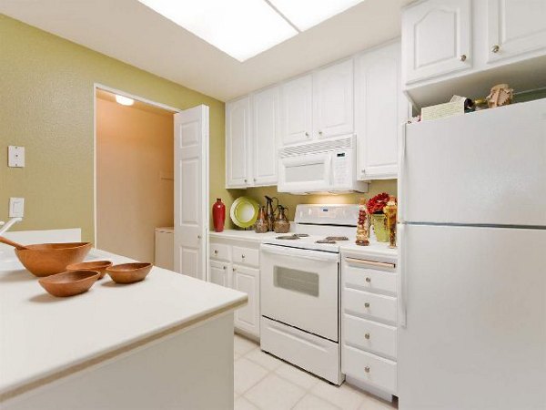 Modern kitchen with stainless steel appliances at Overlook at Bernardo Heights Apartments