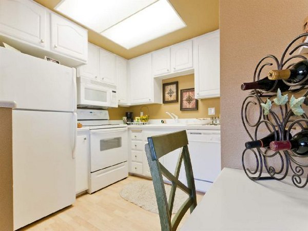 Modern kitchen with stainless steel appliances at Overlook at Bernardo Heights Apartments