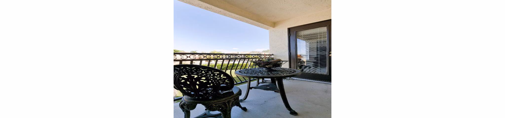 Spacious patio with outdoor seating at Overlook at Bernardo Heights Apartments, offering luxury living by Greystar in scenic surroundings