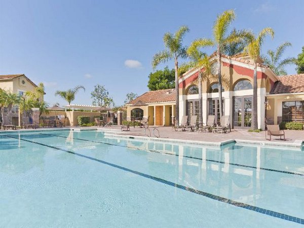 Luxurious pool with sun loungers at Overlook at Bernardo Heights Apartments