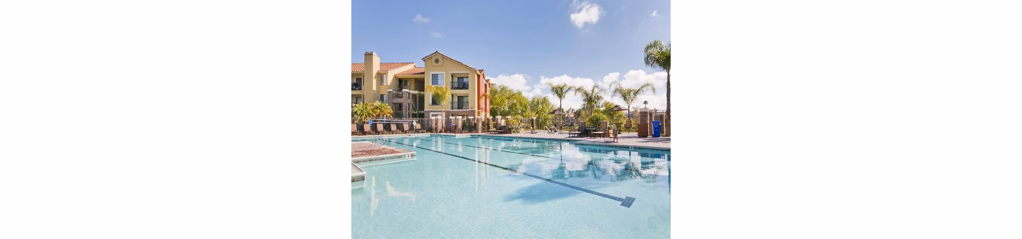 Resort-style pool with lush landscaping at Overlook at Bernardo Heights Apartments