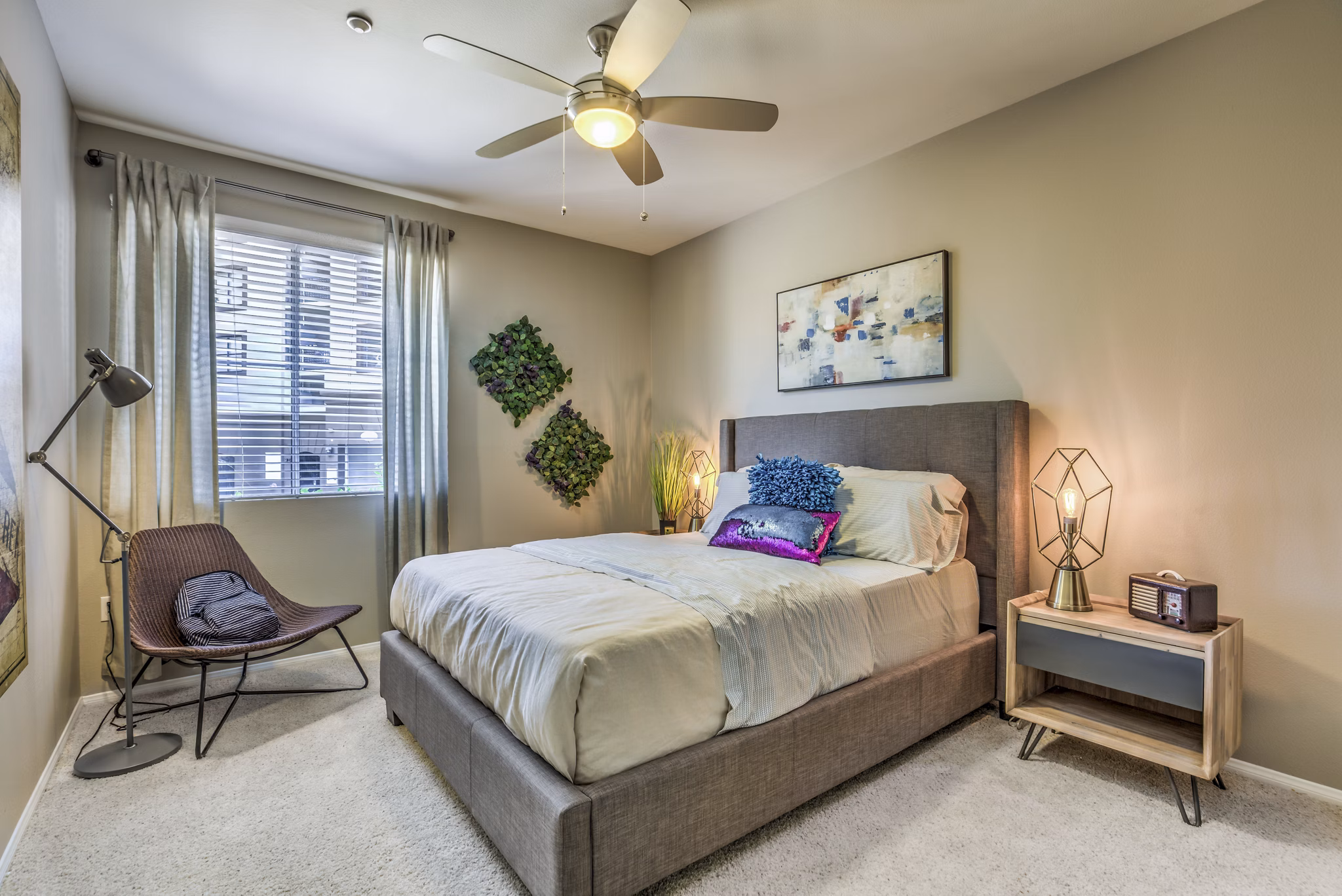 Spacious bedroom with modern decor at Regents Court Apartments in Greystar community