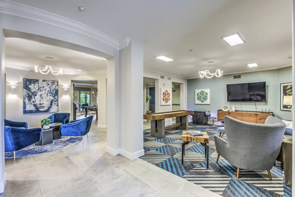 Clubhouse with elegant furnishings at Regents Court Apartments, featuring spaces for entertainment and relaxation
