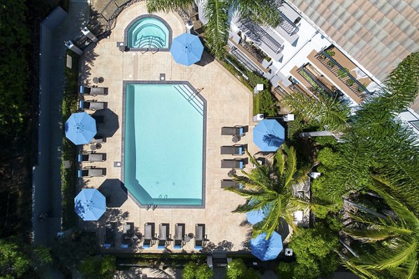 Regents Court: Luxury outdoor pool area with lush landscaping at Regents Court Apartments