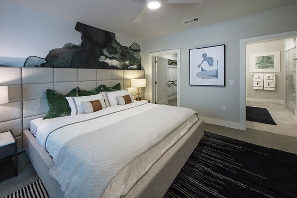 Cozy bedroom with modern furnishings at Ellison Heights Apartments