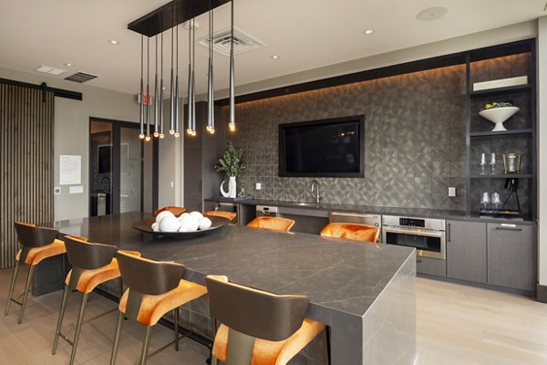 Clubhouse with modern design at Ellison Heights Apartments featuring luxurious seating areas and community spaces