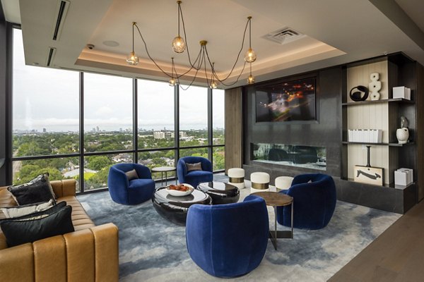 Modern clubhouse with cozy seating and entertainment options at Ellison Heights Apartments