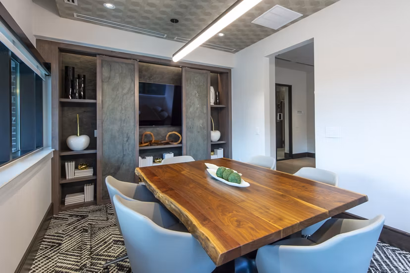 Meeting facility with modern conferencing setup at Ellison Heights Apartments, ideal for corporate gatherings and events