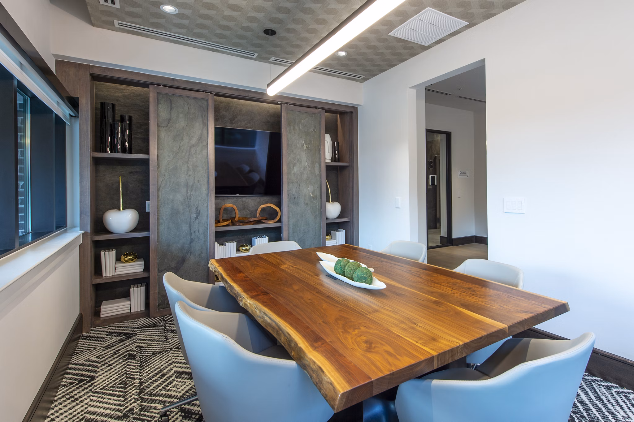 Meeting facility with modern conferencing setup at Ellison Heights Apartments, ideal for corporate gatherings and events