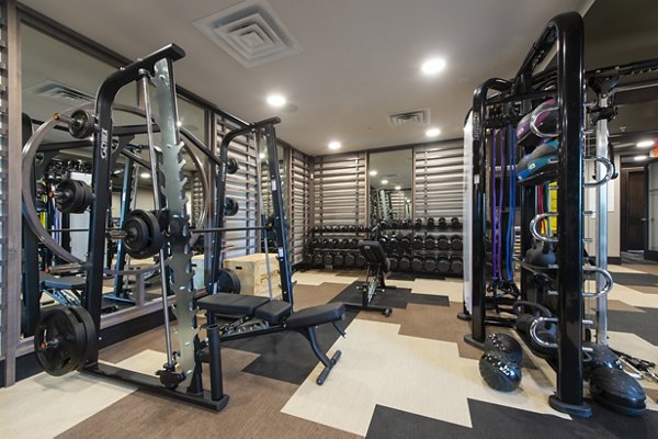 State-of-the-art fitness center with modern equipment at Ellison Heights Apartments, ideal for a luxury workout experience