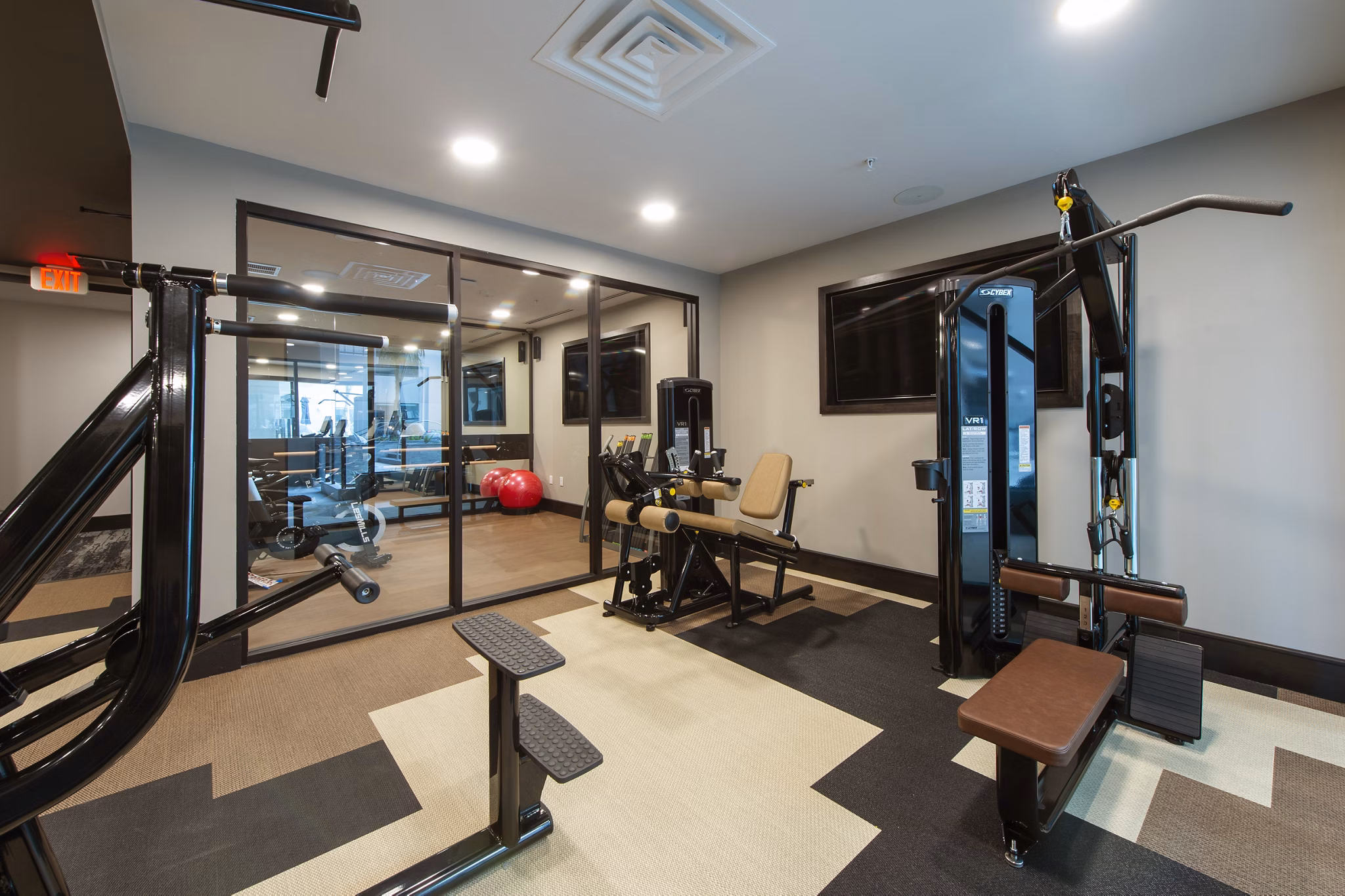 State-of-the-art fitness center at Ellison Heights Apartments with modern equipment and spacious workout areas