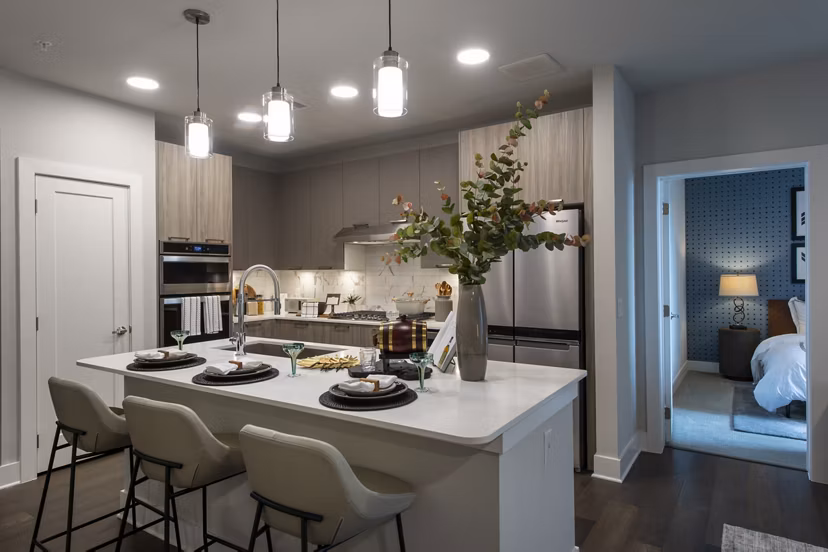 Modern kitchen with stainless steel appliances at Ellison Heights Apartments