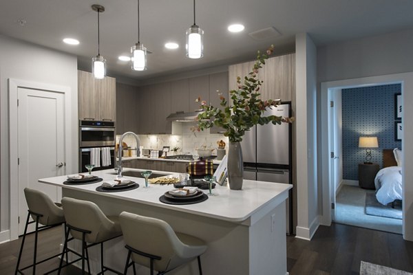 Modern kitchen with stainless steel appliances at Ellison Heights Apartments
