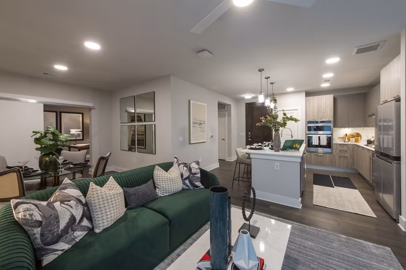 Living room featuring modern furniture and large windows at Ellison Heights Apartments, offering luxury living near shopping and dining