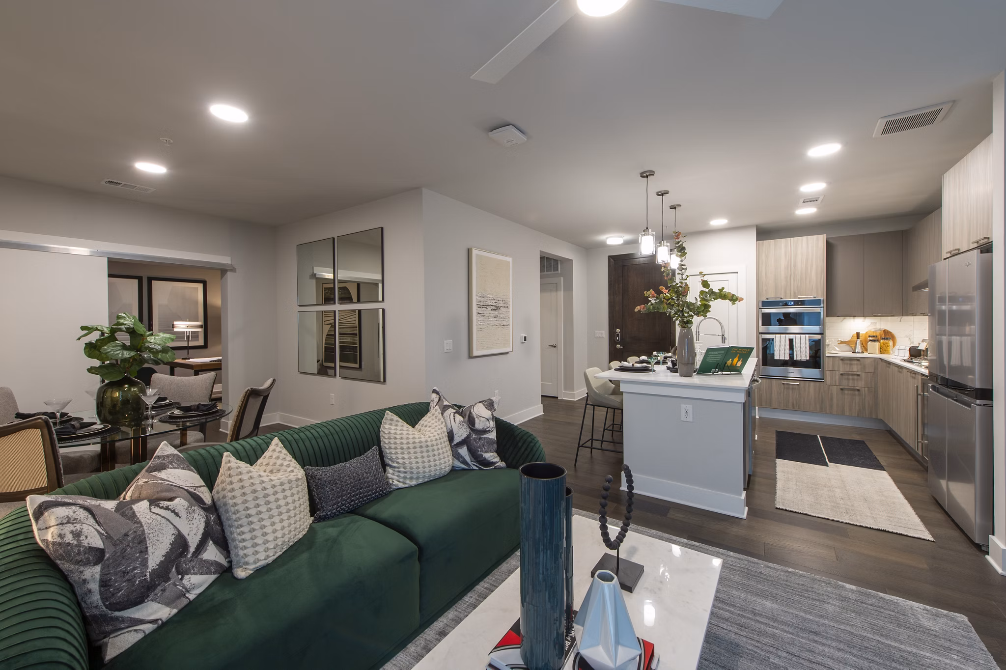 Living room featuring modern furniture and large windows at Ellison Heights Apartments, offering luxury living near shopping and dining