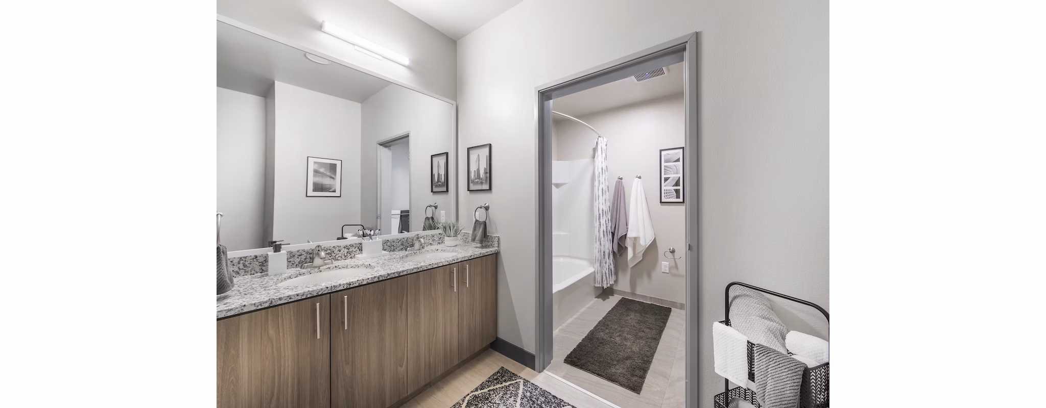 Bathroom with modern fixtures at Hornet Commons Apartments, featuring sleek design and spacious countertops