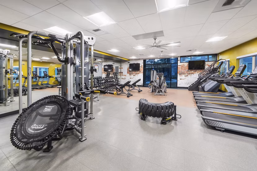 Fitness center with modern equipment at Hornet Commons Apartments