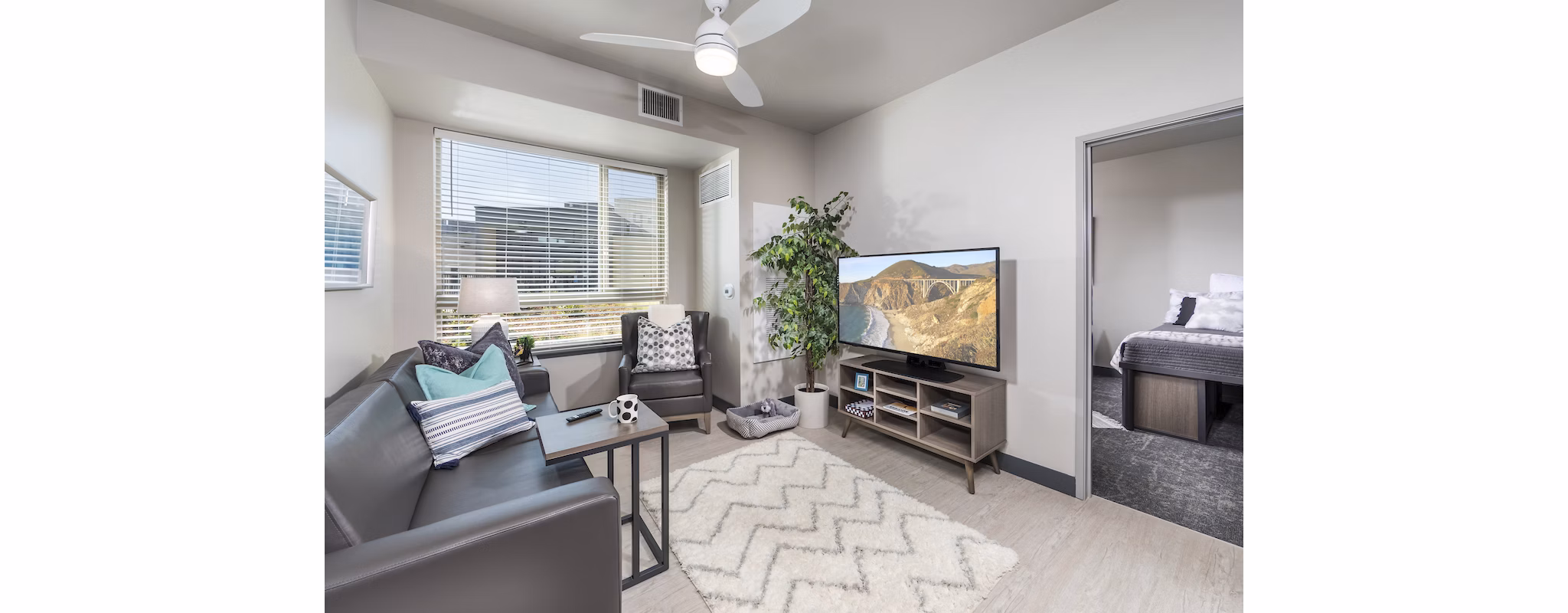 Spacious living room with modern decor at Hornet Commons Apartments, offering luxurious living spaces and amenities for a premium lifestyle