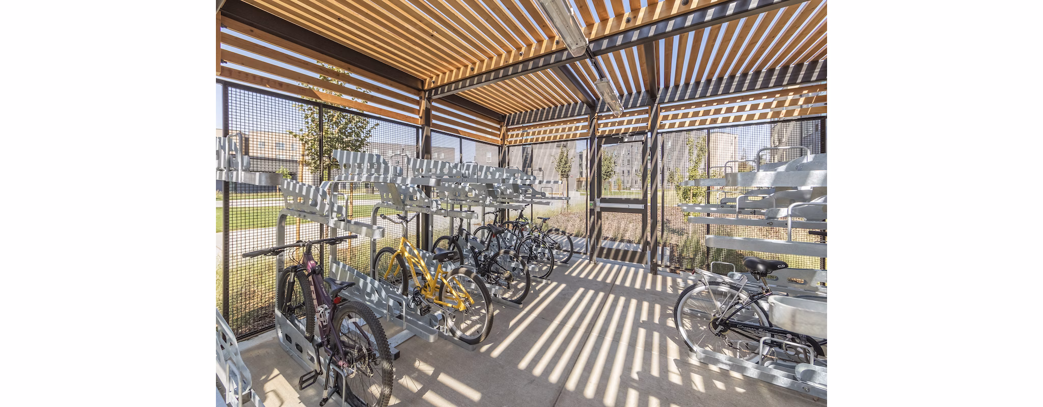 Bike storage room at Hornet Commons Apartments clubhouse featuring secure racks and spacious design