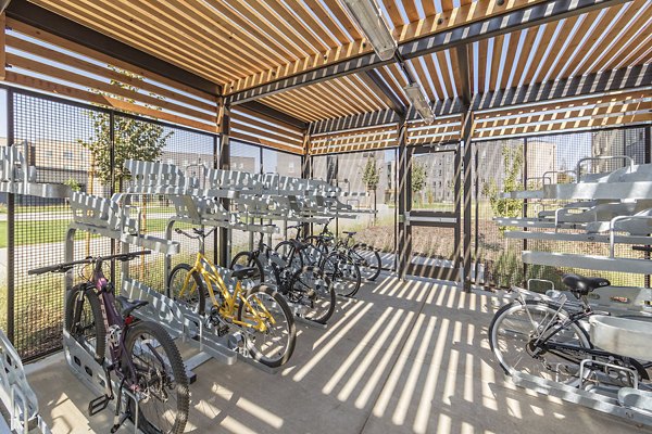 Bike storage room at Hornet Commons Apartments clubhouse featuring secure racks and spacious design