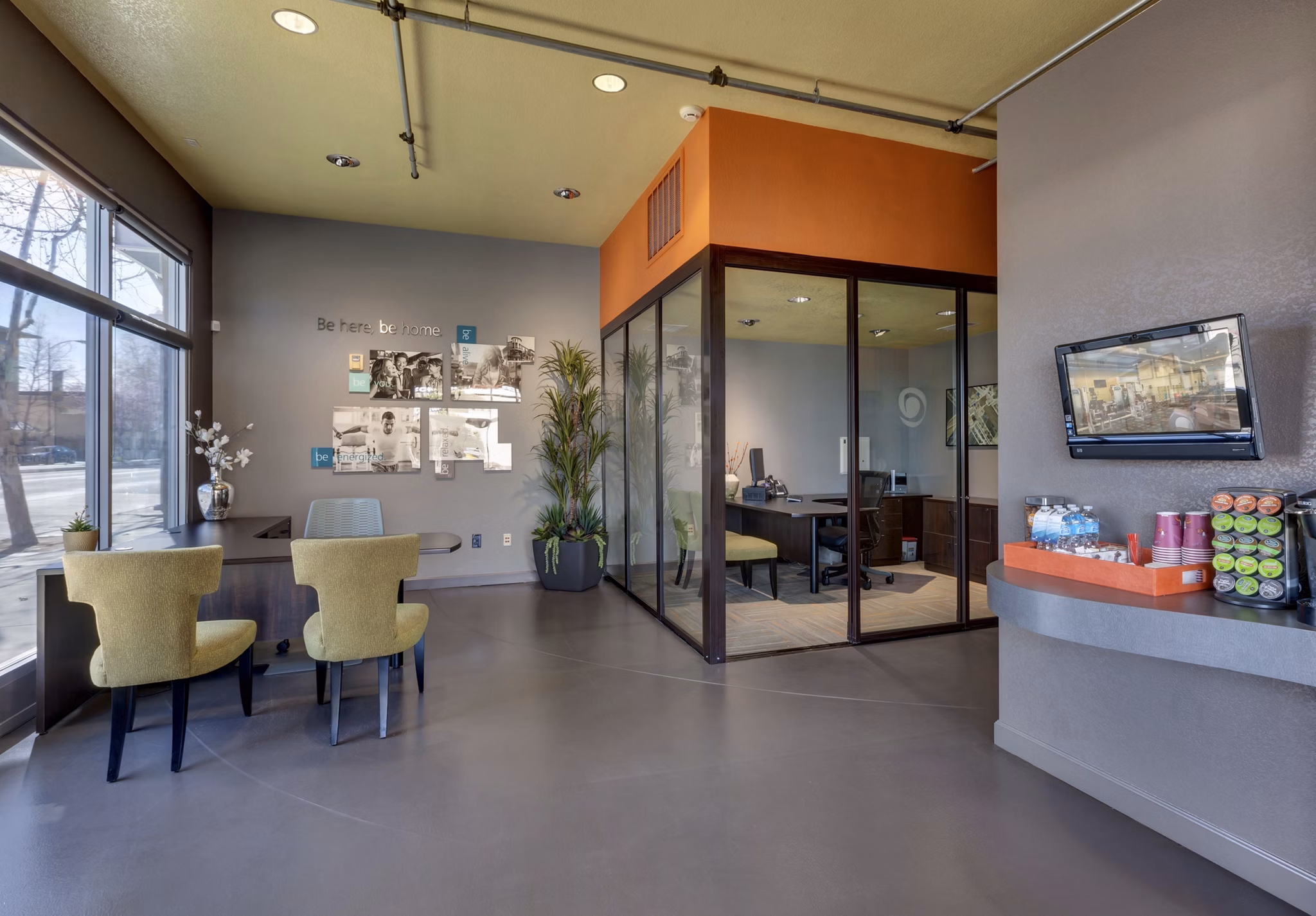 Clubhouse at Museum Park Apartments: Modern community space with plush seating and art decor for residents to socialize and relax