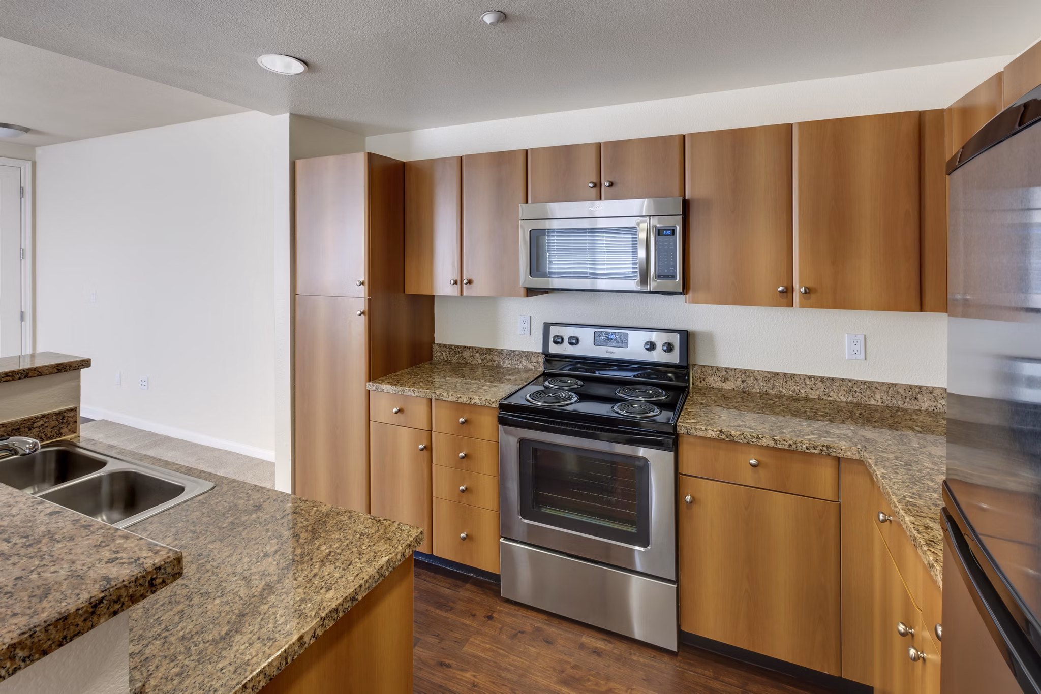 Museum Park Apartments: Modern kitchen with stainless steel appliances and granite countertops