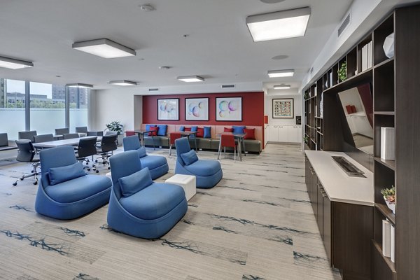 Clubhouse featuring modern seating and open spaces at One South Market Apartments