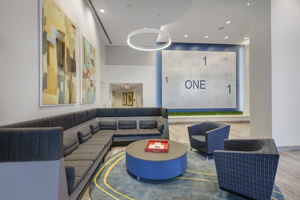 Clubhouse with modern design elements at One South Market Apartments, featuring luxury amenities for relaxation and socializing