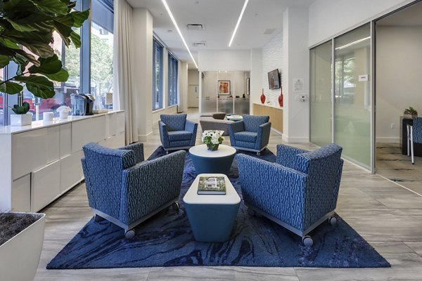 Elegant clubhouse with modern dÃ©cor at One South Market Apartments, perfect for social events and community gatherings
