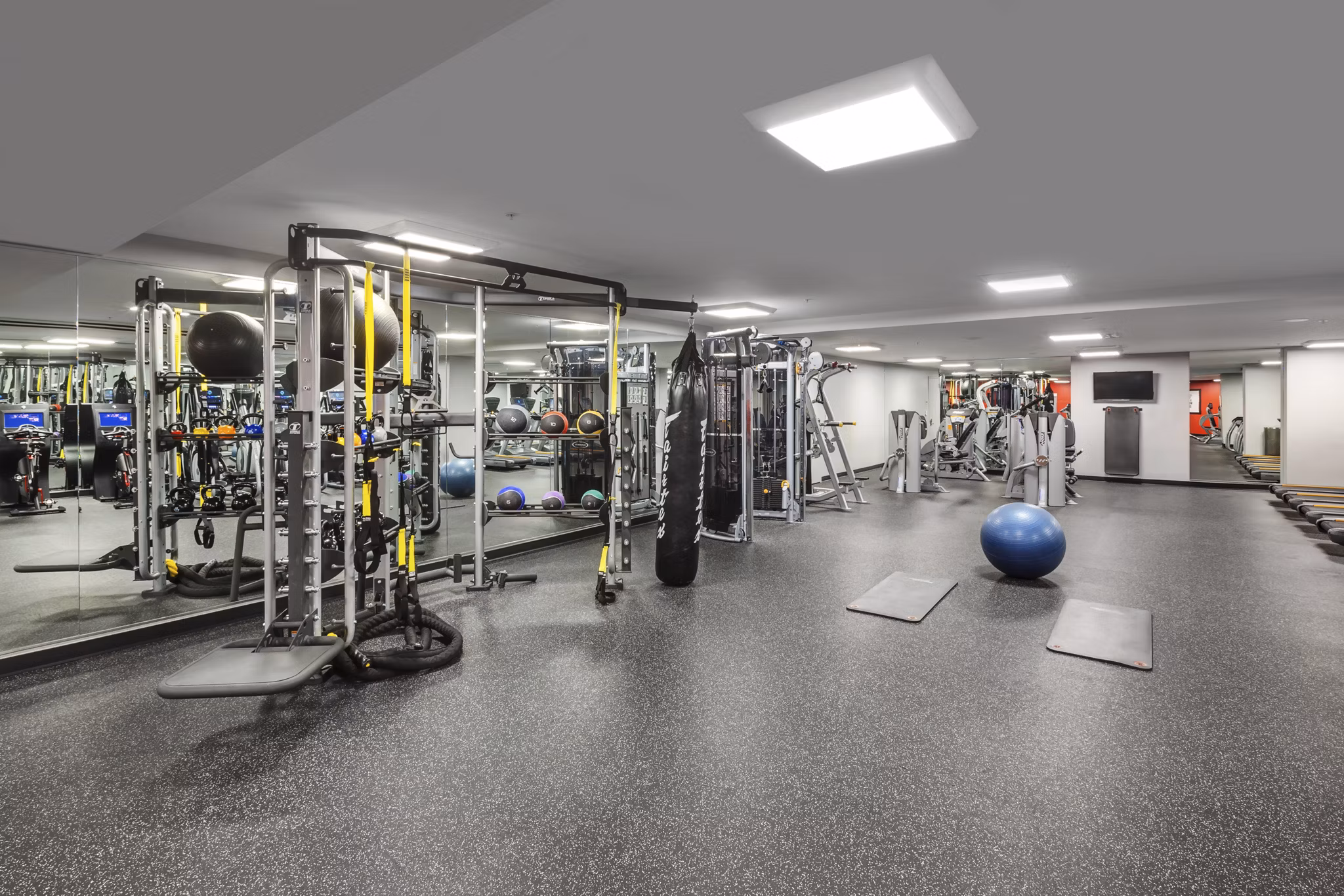 Fitness center with modern equipment at One South Market Apartments