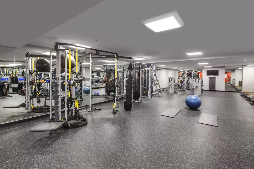 Fitness center with modern equipment at One South Market Apartments