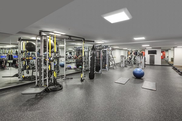 Fitness center with modern equipment at One South Market Apartments