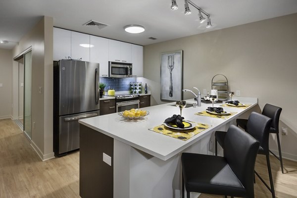 One South Market Apartments: Modern kitchen with stainless steel appliances and quartz countertops