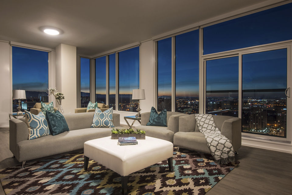 Spacious living room with modern furnishings at One South Market Apartments