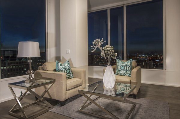 Spacious living room with modern furnishings in One South Market Apartments, San Jose