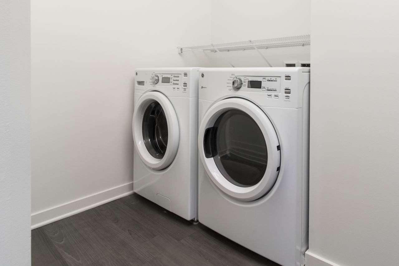 Laundry room at One South Market Apartments