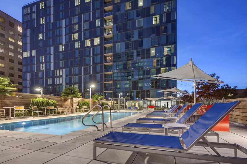 Rooftop pool with city skyline views at One South Market Apartments in San Jose