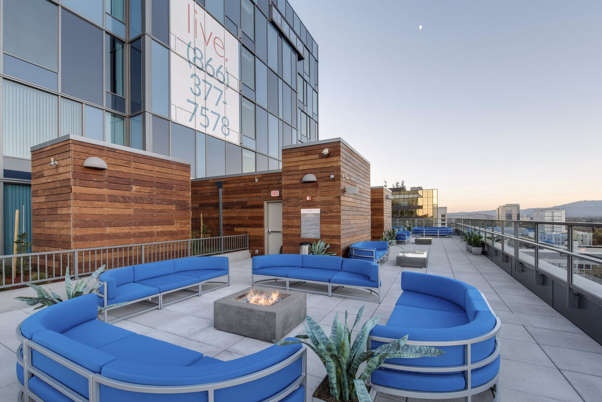 Fire pit with seating area at One South Market Apartments, offering a cozy outdoor amenity in downtown luxury living