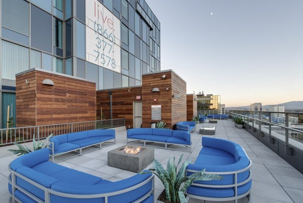 Fire pit with seating area at One South Market Apartments, offering a cozy outdoor amenity in downtown luxury living