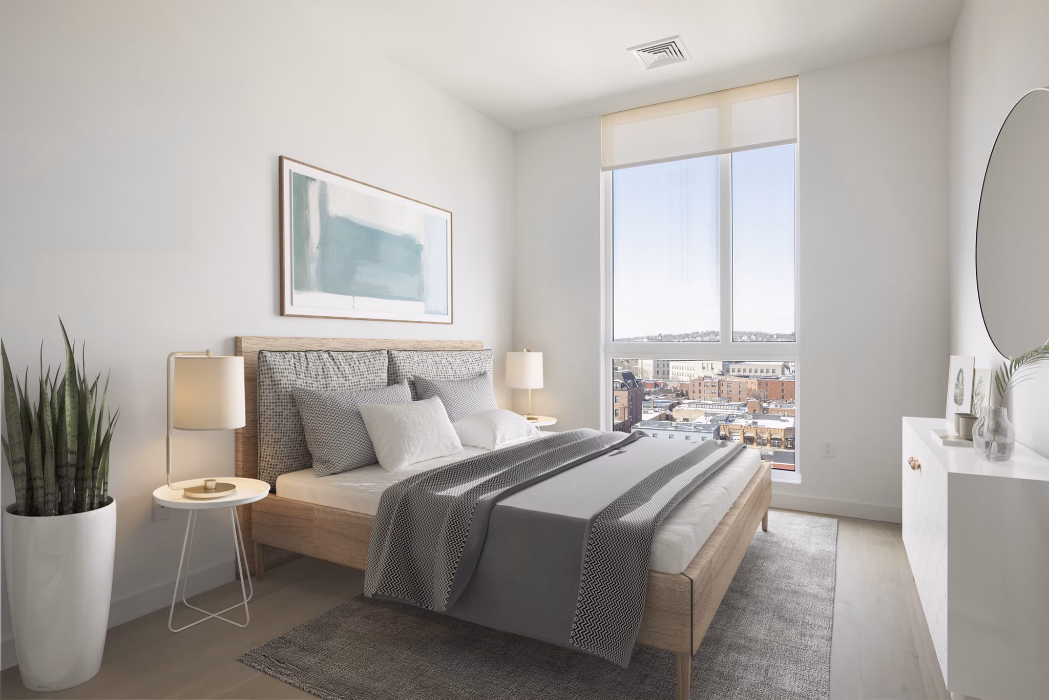 Modern bedroom with minimalist decor at Caldwell Apartments
