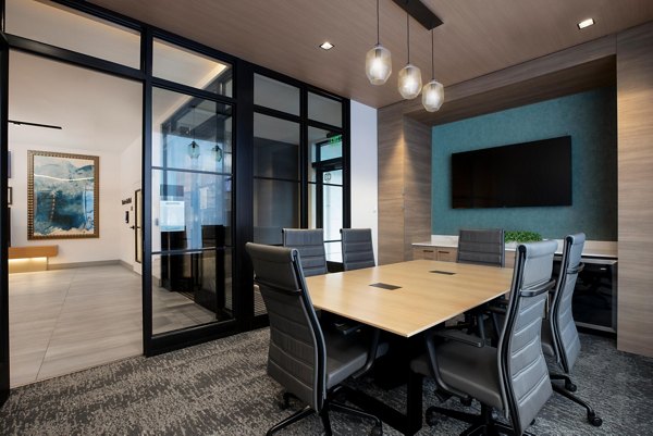 Clubhouse meeting facility with modern seating and collaborative spaces at Caldwell Apartments, ideal for residents to gather and host events