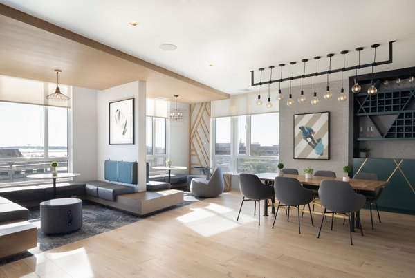 Clubhouse featuring modern design and seating areas at Caldwell Apartments