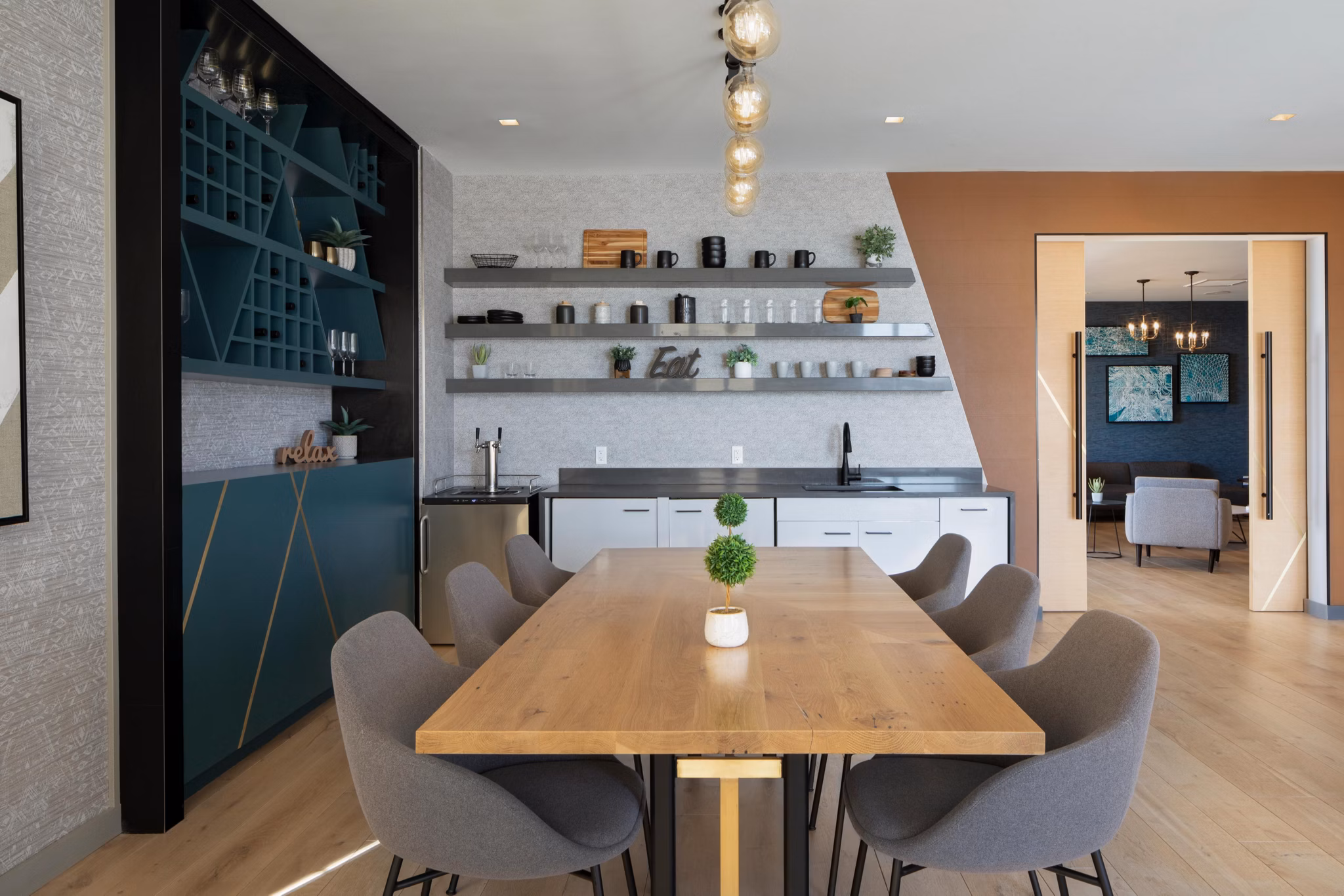 Clubhouse featuring contemporary design and plush seating at Caldwell Apartments for resident gatherings and events