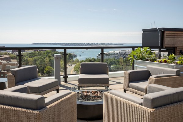 Cozy fire pit on a stylish patio at Caldwell Apartments